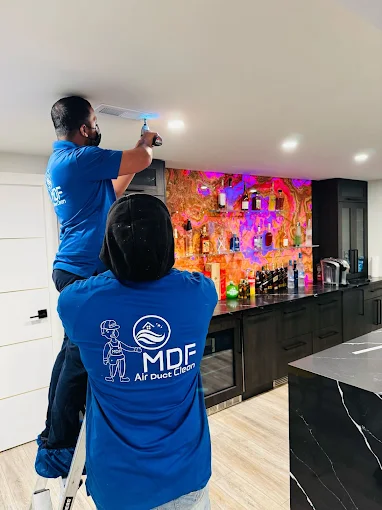 Duct cleaning team working on an Arlington Heights, IL home